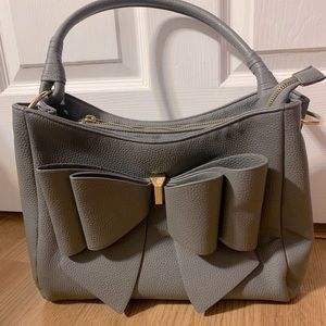 Bow front purse